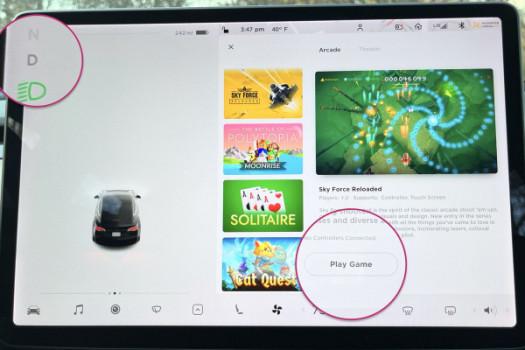 Tesla allows drivers to play video games in moving cars, raising safety concerns