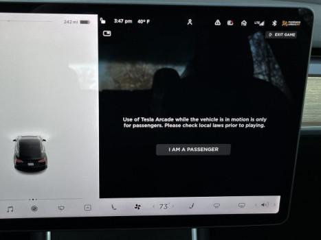 Tesla allows drivers to play video games in moving cars, raising safety concerns1